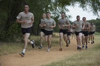 U.S. Air Force Airman Survival, Evasion, Resistance, Escape (SERE) candidates jog on a one-mile track at Joint Base San Antonio-Lackland Medina Annex, Texas.