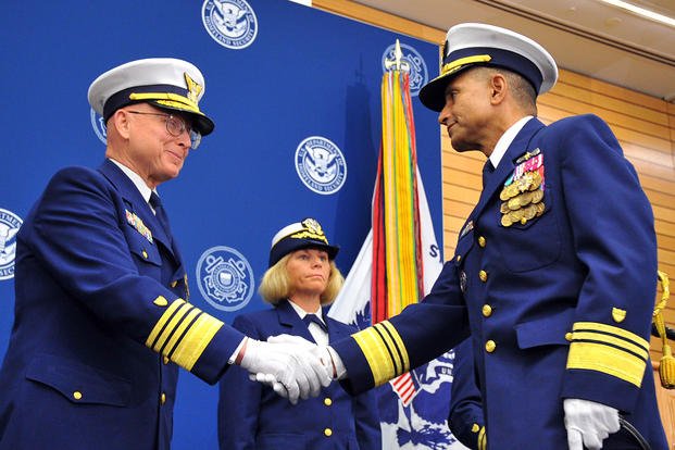 Coast Guard Commandant Adm. Bob Papp congratulates Vice Adm. Manson K. Brown during his retirement ceremony. (U.S. Coast Guard photo by Petty Officer 2nd Class Patrick Kelley)