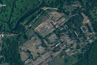 This satellite image shows apparent recent construction of tents at a former military base outside the Belarusian town of Osipovichi. 