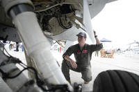 F-16 fighter jet pilot poses for a photo at Paris Air Show