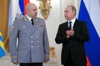 Vladimir Putin applauds Col. Gen. Sergei Surovikin