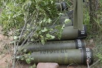 U.S.-supplied M777 howitzer shells lie on the ground to fire at Russian positions in Ukraine