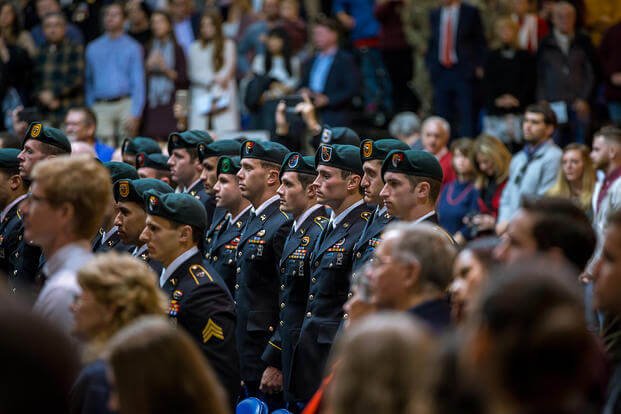 Soldiers graduate and earn the honor of becoming Green Berets.