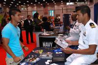 Navy recruiter discusses opportunities with a prospective recruit