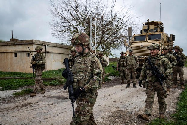 American soldiers patrol the countryside of Rumaylan (Rmeilan) in Syria's northeastern Hasakeh province near the border with Turkey.