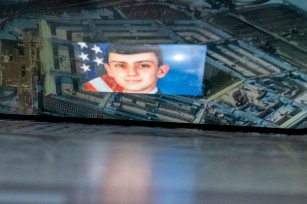 National Guardsman Jack Teixeira, reflected in an image.